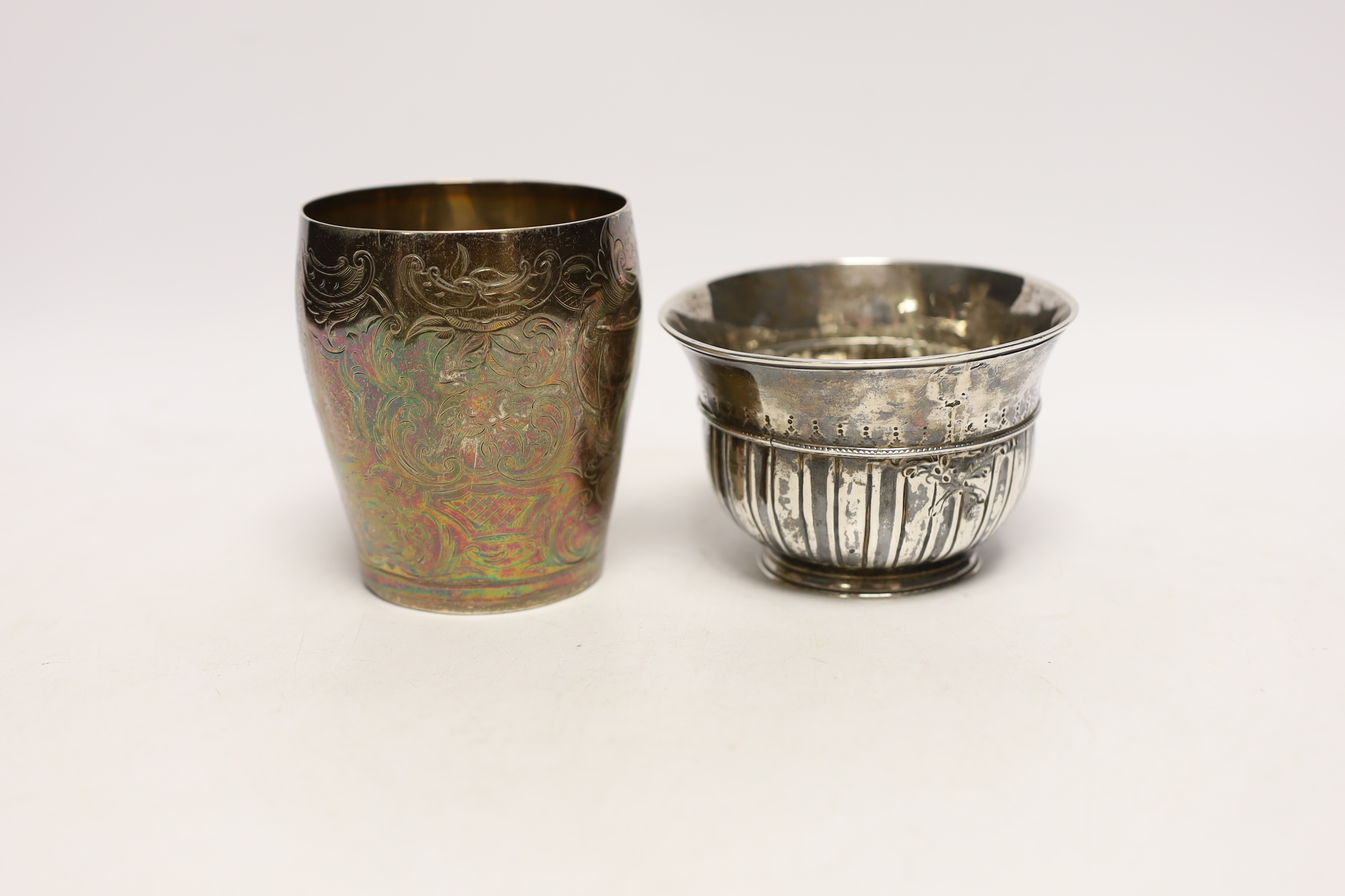 An early George III repousse silver bowl, London, 1764, diameter 9.8cm and a George III engraved silver beaker, London, 1784, 8.8oz.